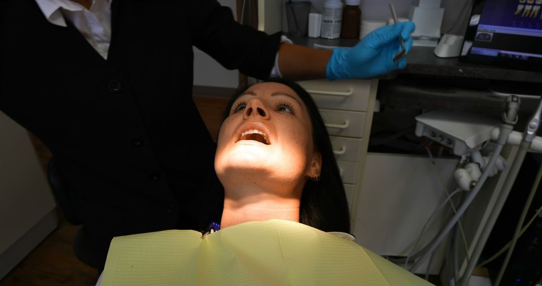 Patient Receiving Dental Treatment in Clinic - Free Images, Stock Photos and Pictures on Pikwizard.com