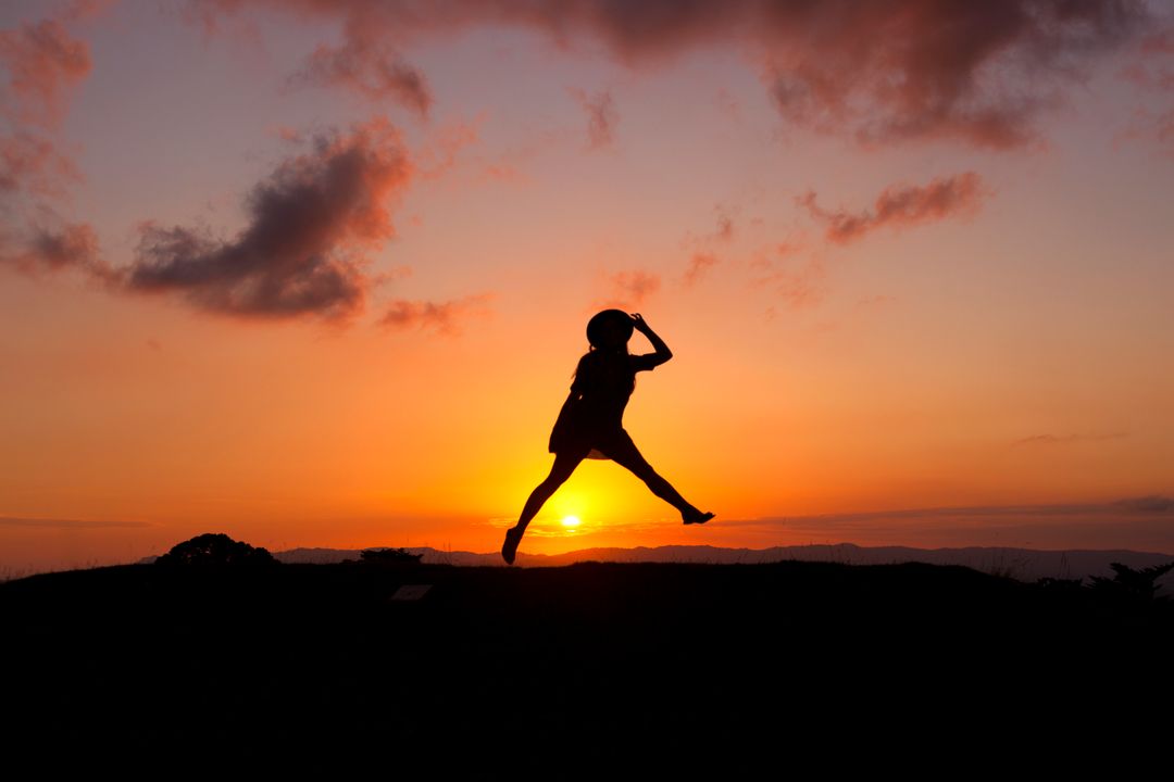 Person Jumping during Sunset on Low Angle View Photography - Free Images, Stock Photos and Pictures on Pikwizard.com