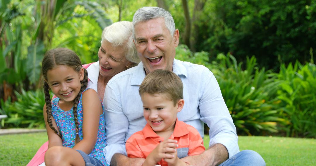 Happy grandparents enjoying moments with grandchildren in garden - Free Images, Stock Photos and Pictures on Pikwizard.com