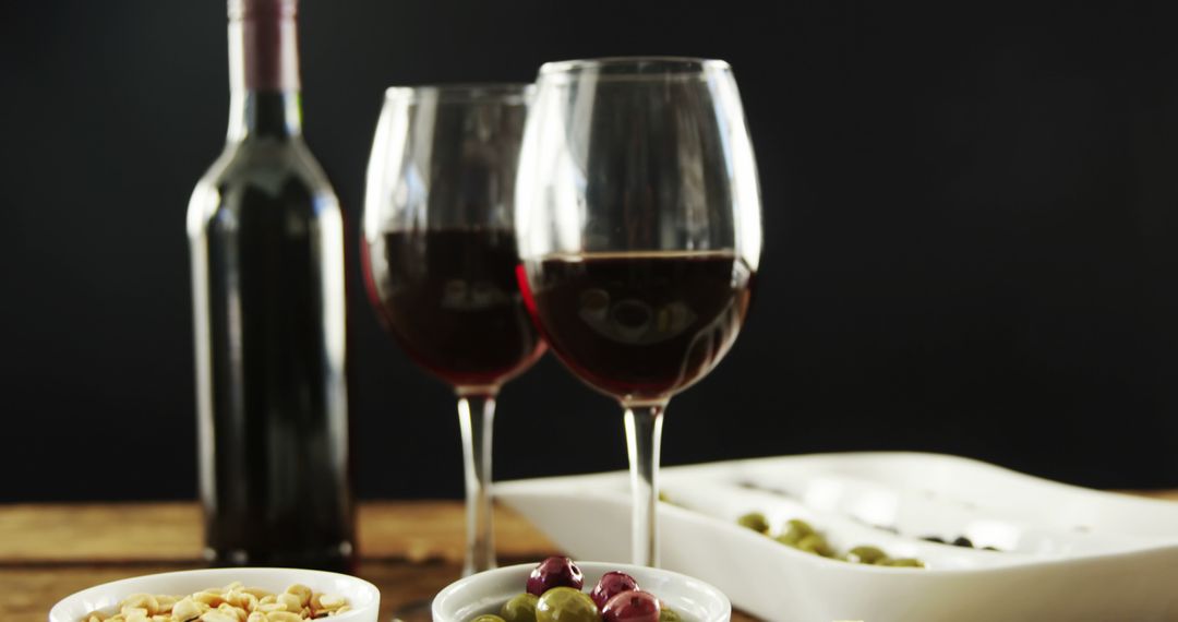 Red Wine with Appetizers on Wooden Table - Free Images, Stock Photos and Pictures on Pikwizard.com