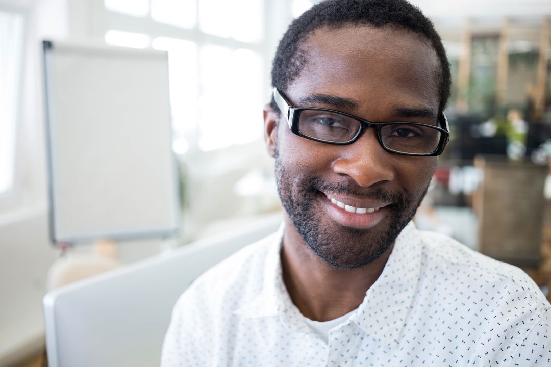 Confident Professional Smiling in Modern Workplace