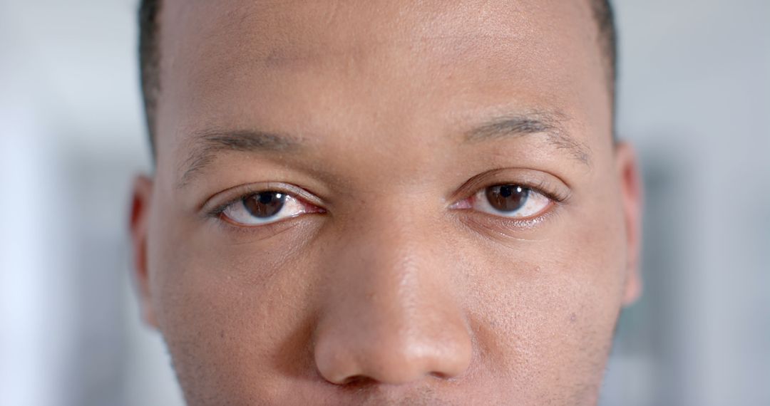 Close-Up of Young Adult Man's Face with Thoughtful Expression - Free Images, Stock Photos and Pictures on Pikwizard.com