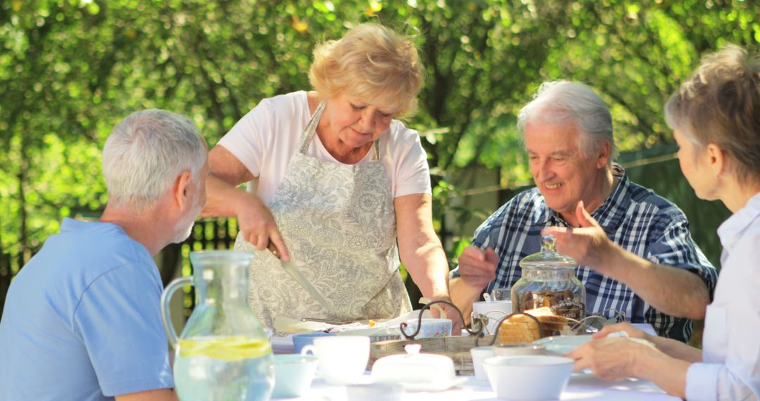 Senior Friends Enjoying Outdoor Lunch Gathering - Free Images, Stock Photos and Pictures on Pikwizard.com