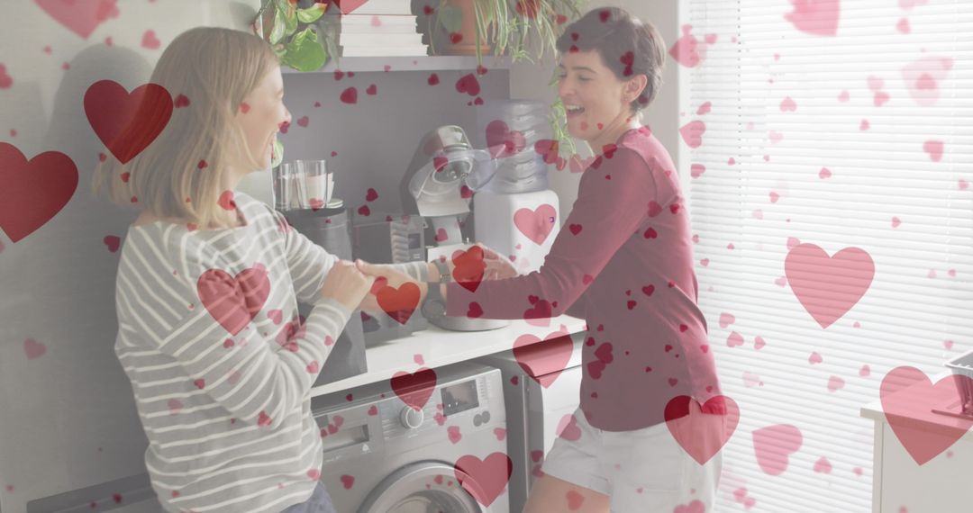Romantic Couple Dancing in Kitchen with Heart Overlays