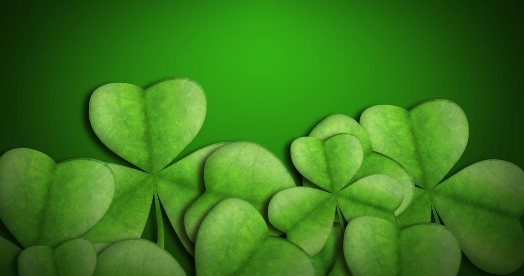 Vibrant Clover Leaves on Emerald Green Background with Space