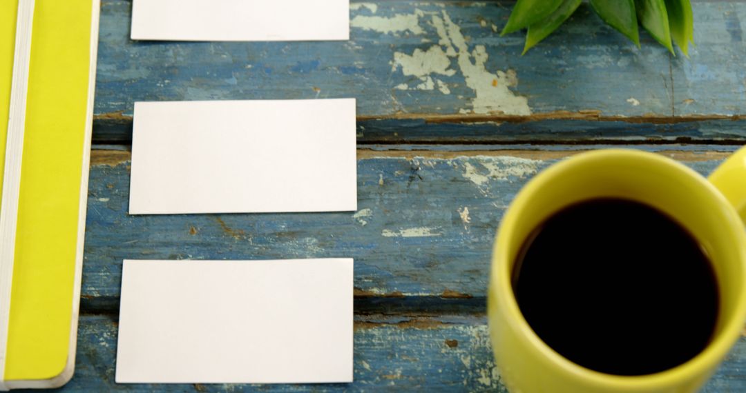 Organized Workspace with Coffee Mug and Blank Cards on Rustic Blue Table - Free Images, Stock Photos and Pictures on Pikwizard.com