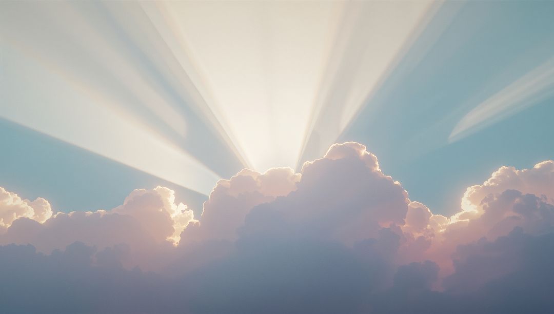 Rays of Sunlight Through Cumulus Clouds in Serene Sky