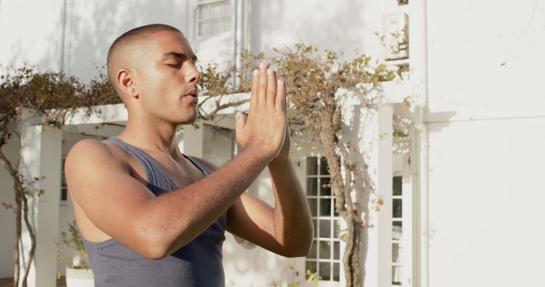 Young Man Practicing Yoga with Namaste Posture Outdoors - Free Images, Stock Photos and Pictures on Pikwizard.com