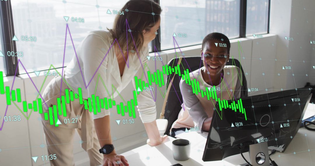 Diverse Female Colleagues Analyzing Data on Office Computer