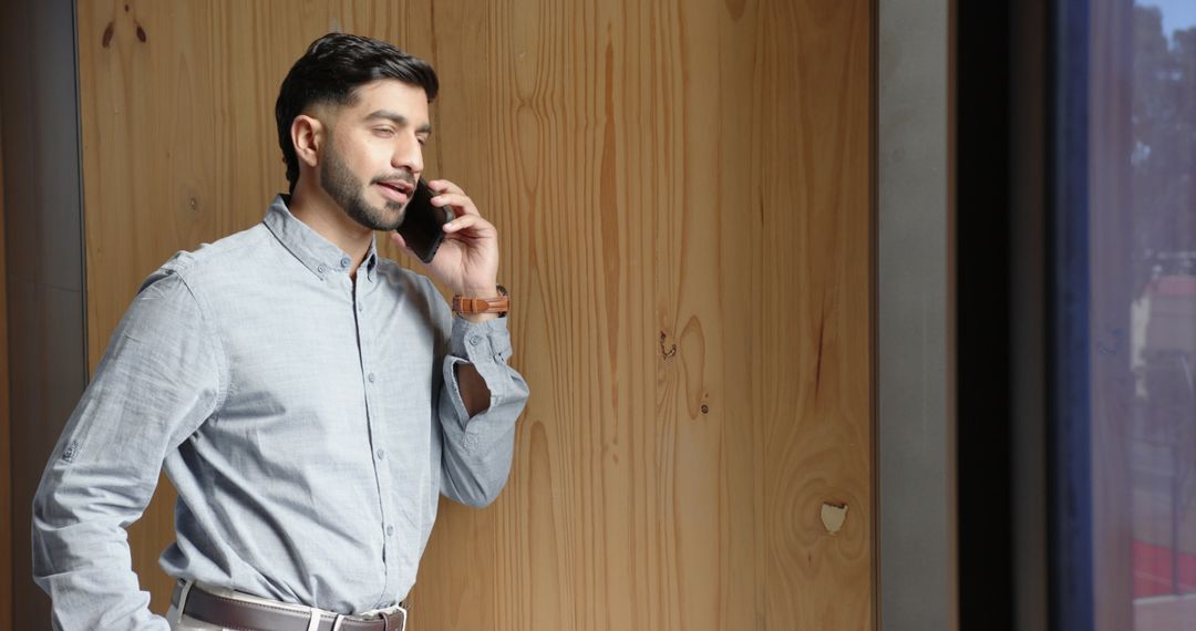 Businessman Engaged in a Phone Call in Urban Workspace