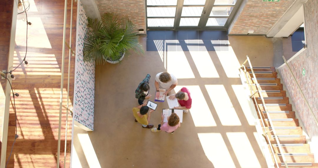 Diverse Team Collaborating in Sunny Office