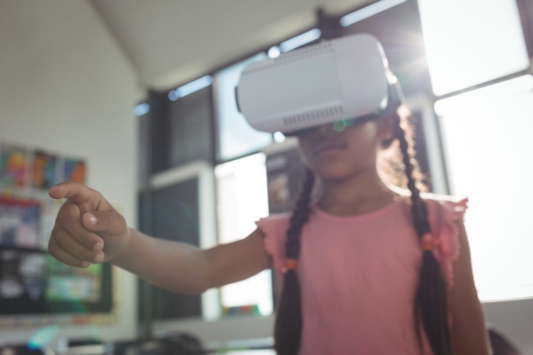 Girl Using Virtual Reality Headset in Classroom - Free Images, Stock Photos and Pictures on Pikwizard.com