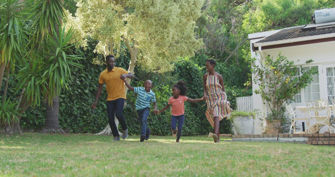 Happy Family Running in Backyard on Sunny Day - Free Images, Stock Photos and Pictures on Pikwizard.com