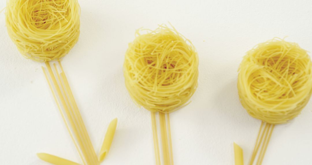 Abstract Spaghetti Flower Arrangement on White Surface