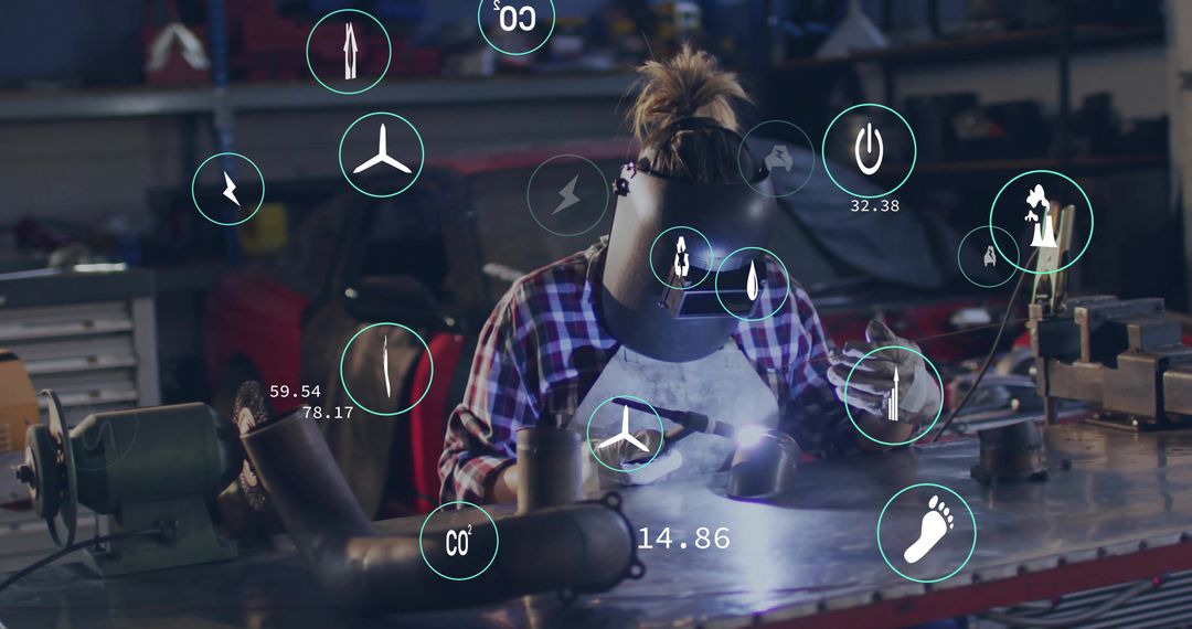 Skilled Female Welder Working with Augmented Reality Technology in Workshop