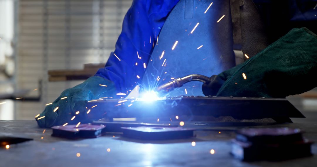 Industrial Welder Sparking in Workshop - Free Images, Stock Photos and Pictures on Pikwizard.com