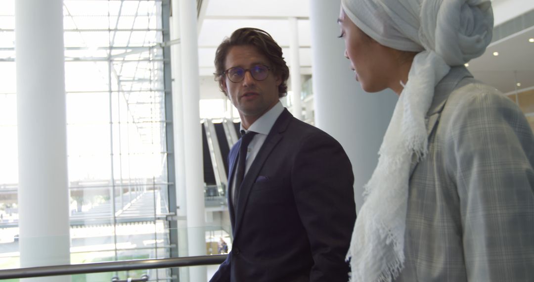 Diverse Business Professionals in Modern Office Discussing Work Solutions