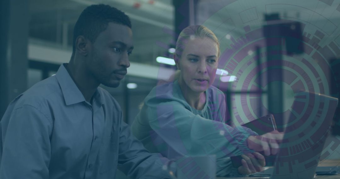 Business Colleagues Analyzing Digital Interface in Office