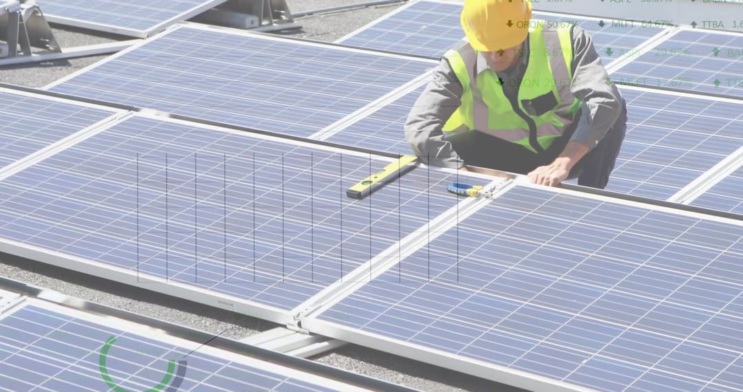 Engineer Working on Solar Panels with Digital Financial Data Overlay - Free Images, Stock Photos and Pictures on Pikwizard.com