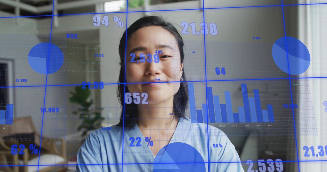 Korean professional presenting blue data visualization overlay in home office