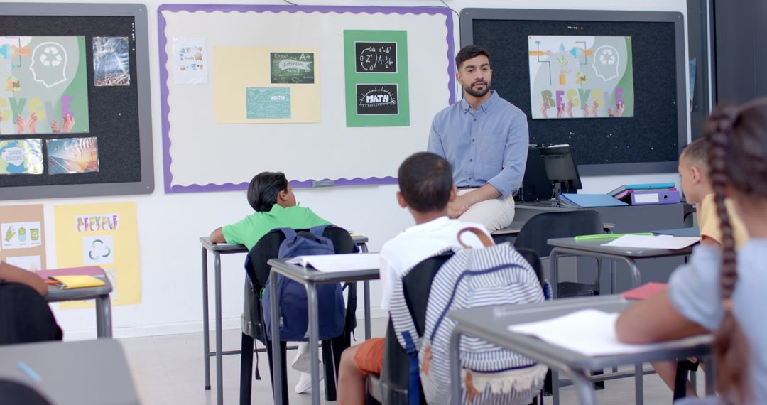 Engaging Teacher Conducts Lesson in Diverse Classroom Environment