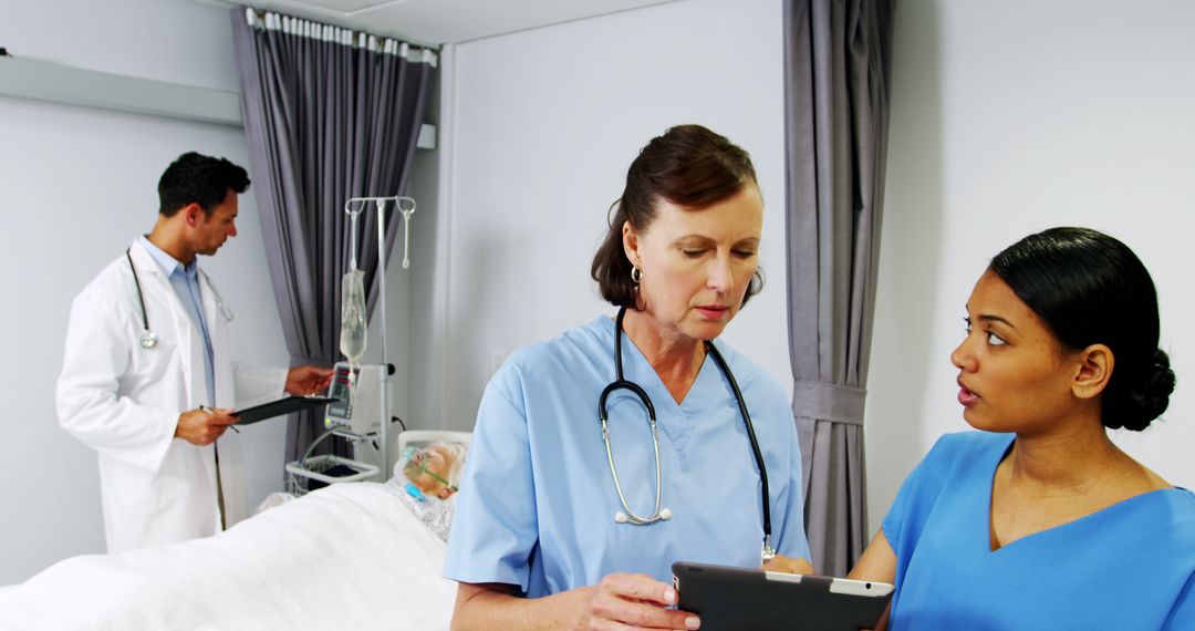 Medical Professionals Discussing Patient Care in Hospital Room - Free Images, Stock Photos and Pictures on Pikwizard.com