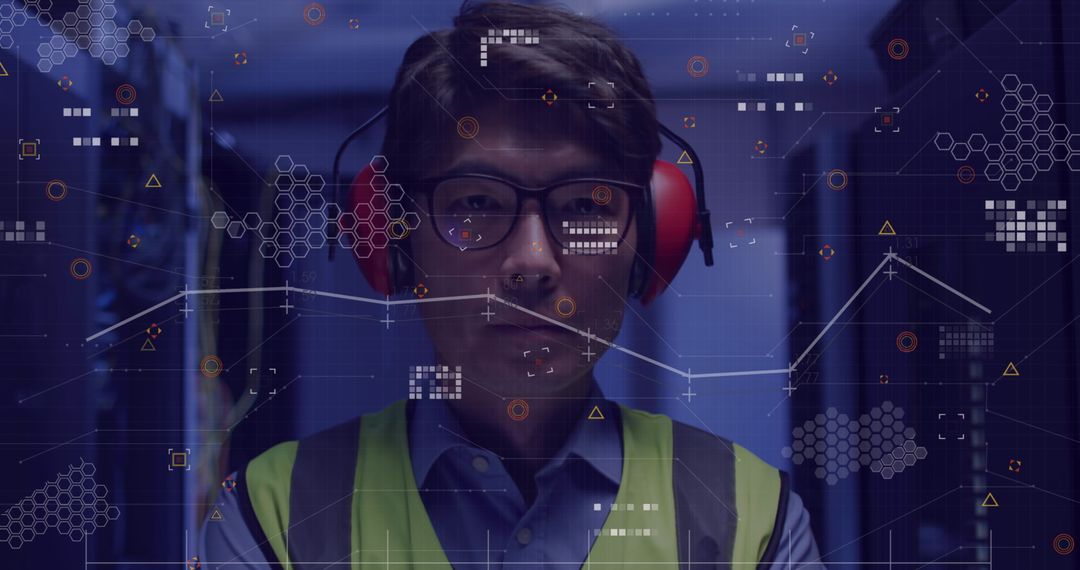 Asian Engineer Analyzing Data in Server Room with Digital Overlay