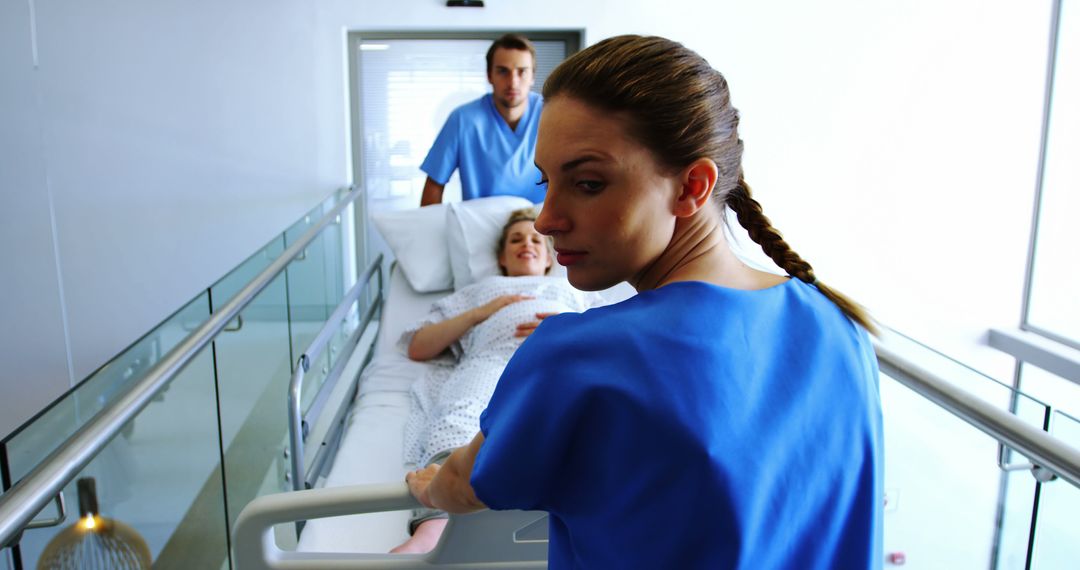 Nurse and Doctor Transporting Patient on Hospital Stretcher - Free Images, Stock Photos and Pictures on Pikwizard.com