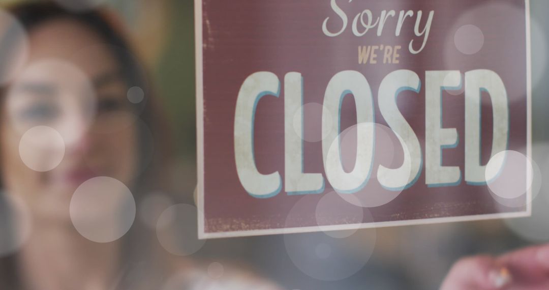 Business Storefront with Closed Sign and Light Bokeh