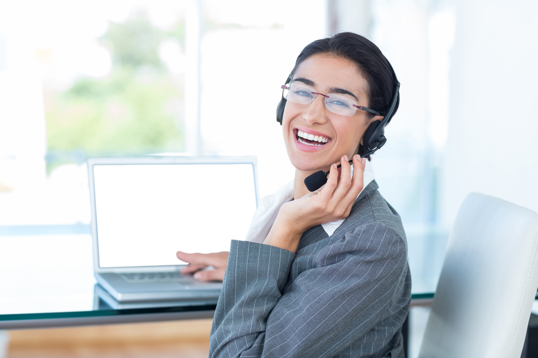 Smiling Transparent Call Centre Executive Using Laptop in Office - Download Free Stock Images Pikwizard.com