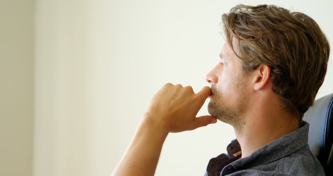 Caucasian Man Contemplating Ideas in Office