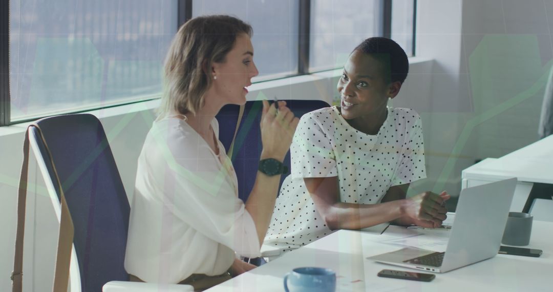 Diverse Coworkers Discussing Financial Strategy in Modern Office
