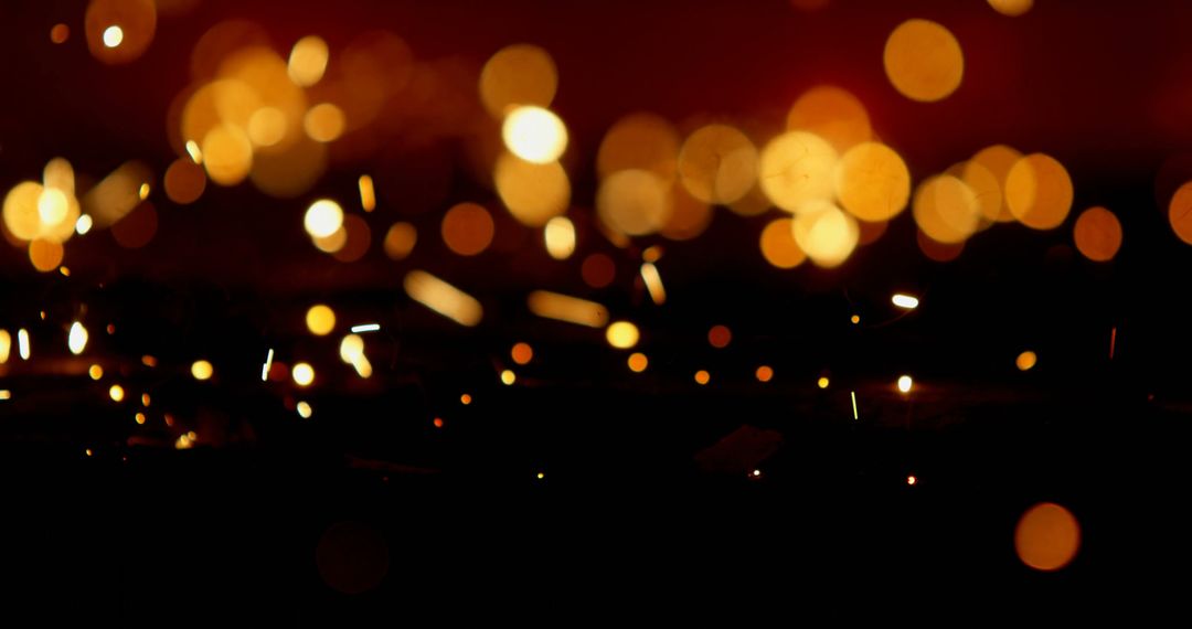 Golden Bokeh Lights with Sparkles on Dark Background - Free Images, Stock Photos and Pictures on Pikwizard.com