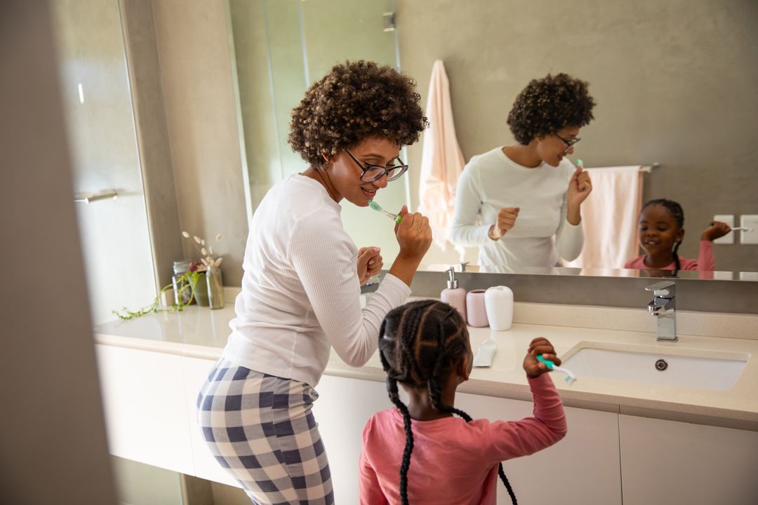 Mother and Daughter Bonding During Morning Teeth Brushing Routine