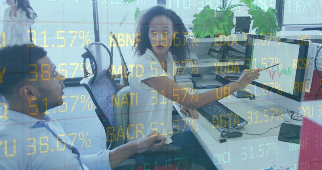 Colleagues Discuss Stock Market Data in Modern Office