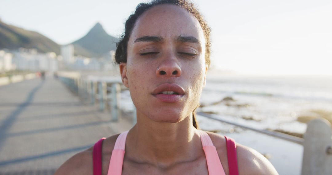 Fit African American Woman Taking a Break After Running by the Ocean - Free Images, Stock Photos and Pictures on Pikwizard.com