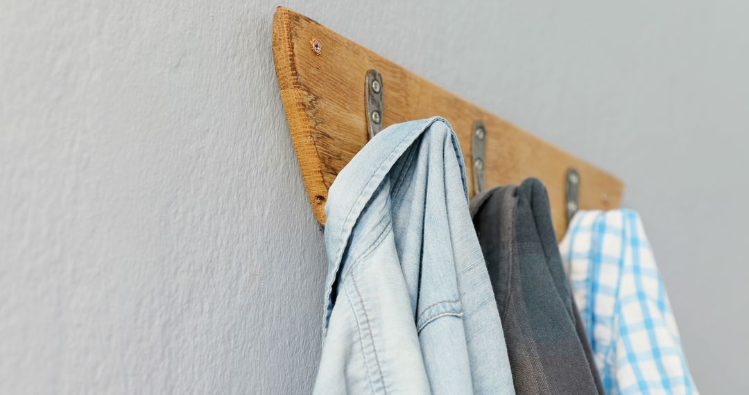 Cozy Clothes Hanging on Rustic Wooden Coat Rack in Minimalist Room - Free Images, Stock Photos and Pictures on Pikwizard.com