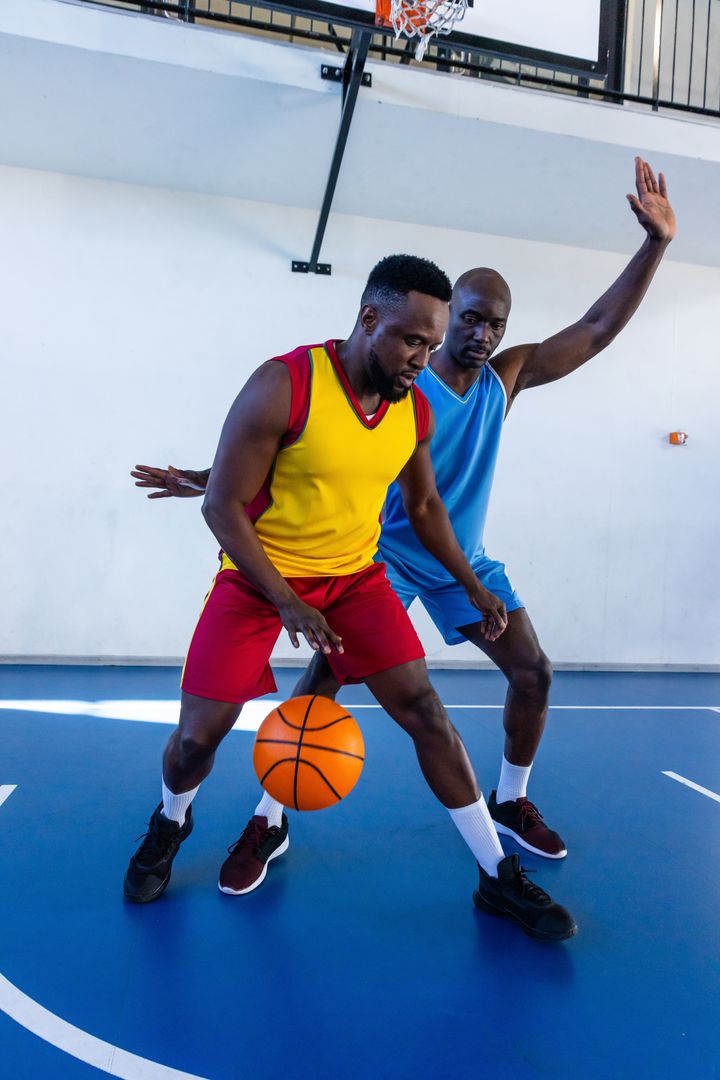 Intense Basketball Match with Players in Action on Indoor Court