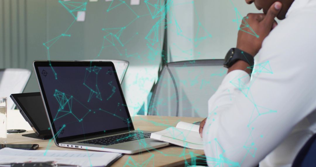 Business Professional Analyzing Data on Laptop in Contemporary Workspace