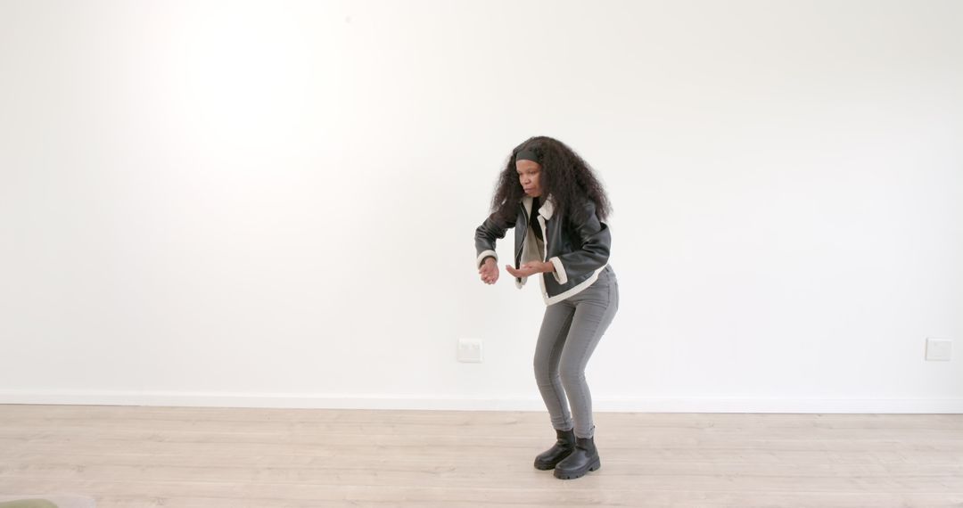 Confident Woman Posing Stylishly in Minimalistic Setting