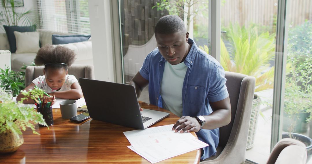 Image of african american father and daughter using laptop and learn - Free Images, Stock Photos and Pictures on Pikwizard.com