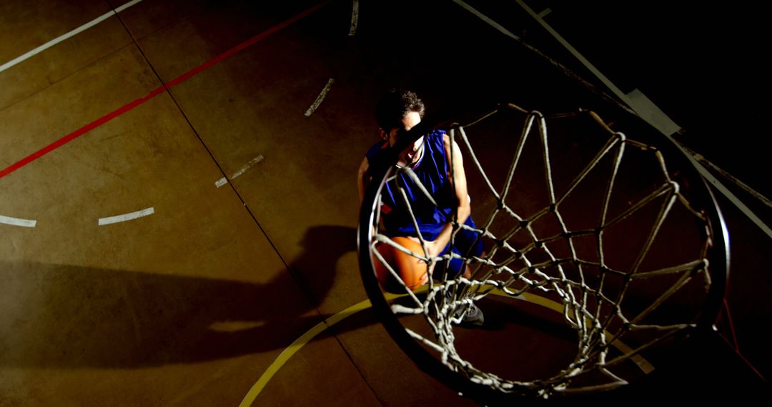 Basketball Player Aiming for Slam Dunk at Indoor Court - Free Images, Stock Photos and Pictures on Pikwizard.com