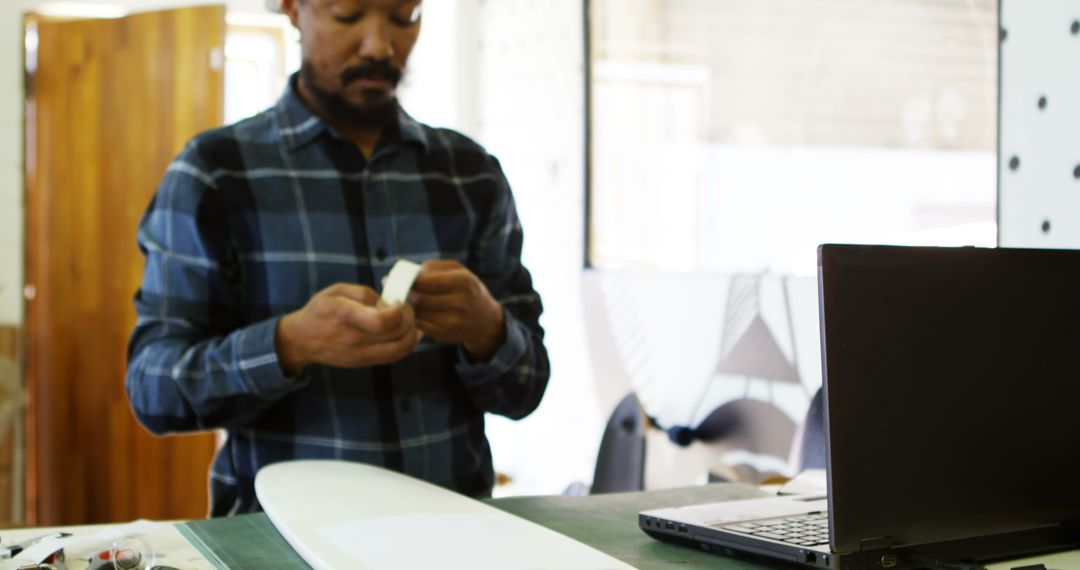 Skilled Craftsman in Workshop Using Modern Technology to Enhance Craft