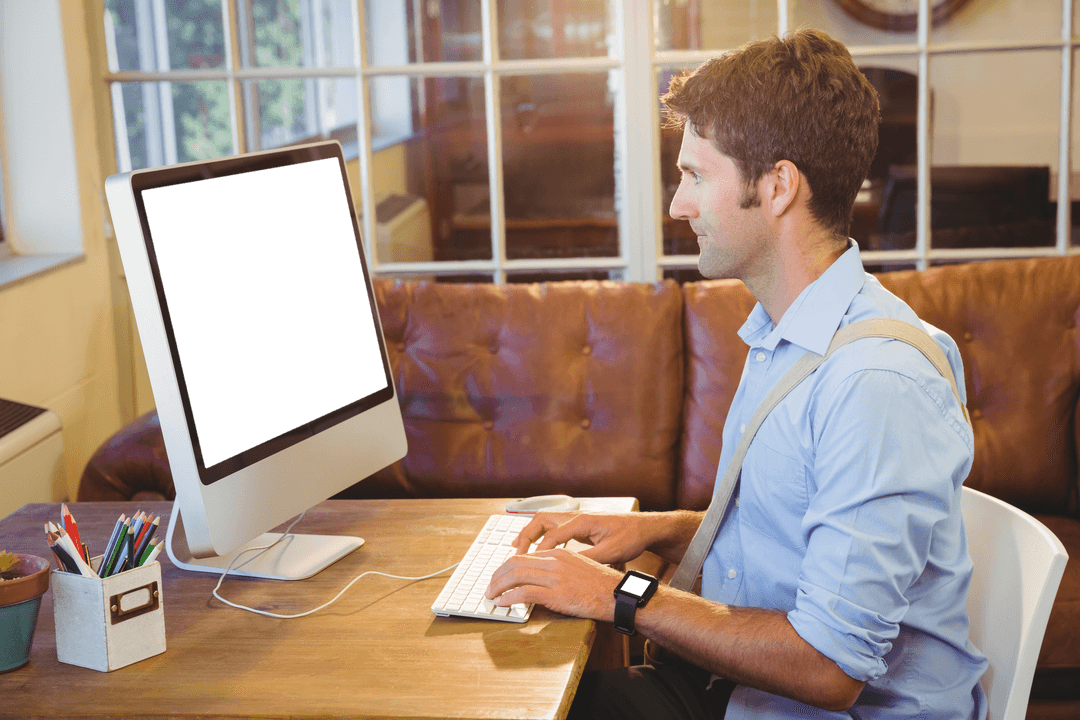 Transparent Office Workspace Featuring Businessman at Desk with Computer