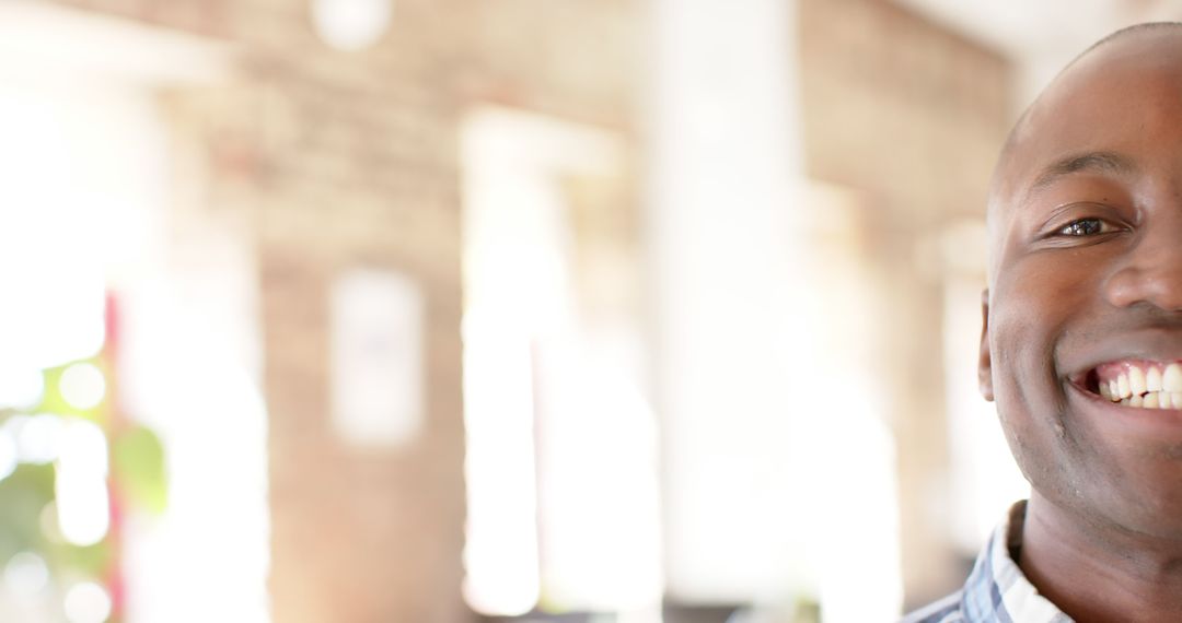 Smiling African American Man in Bright Office Environment
