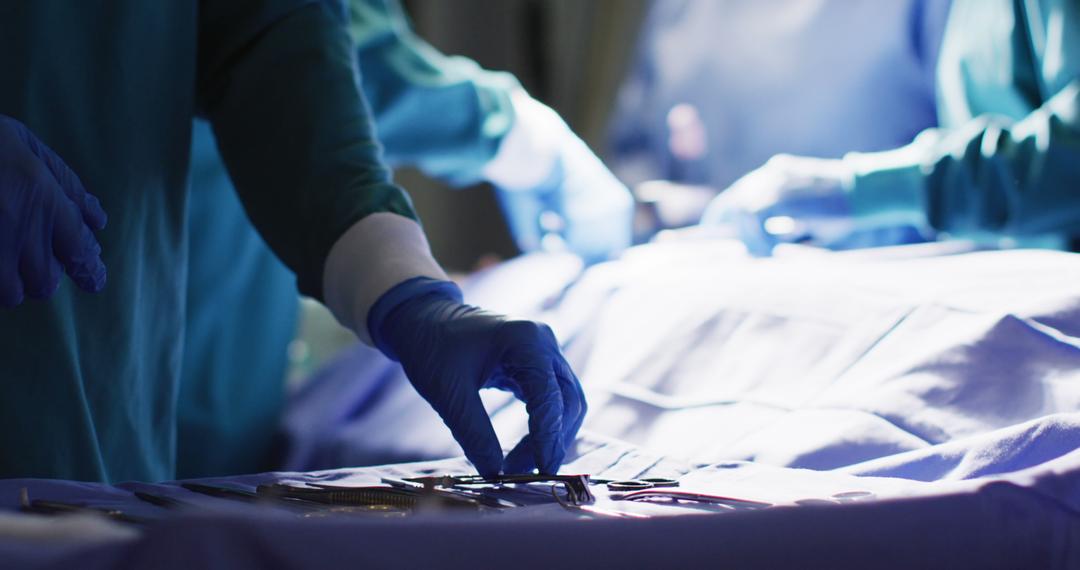 Medical Team Performing Surgery with Surgical Instruments in Operating Room - Free Images, Stock Photos and Pictures on Pikwizard.com