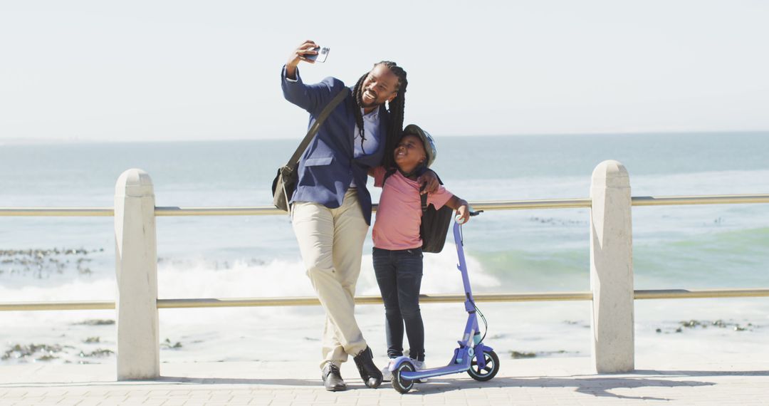 Father and Daughter Taking Selfie by the Sea - Free Images, Stock Photos and Pictures on Pikwizard.com