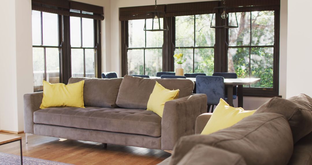 Cozy Modern Living Room with Gray Sofa and Yellow Pillows - Free Images, Stock Photos and Pictures on Pikwizard.com