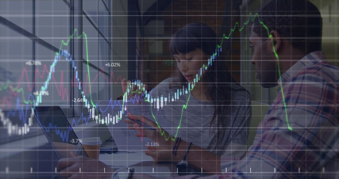 Diverse Coworkers Analyzing Financial Growth Charts