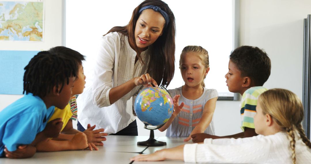 Teacher Explaining Globe to Curious Children in Classroom - Free Images, Stock Photos and Pictures on Pikwizard.com